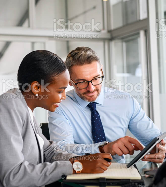 Business partners working on digital tablet in modern office