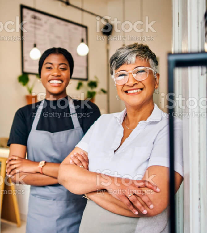 Coffee shop, senior woman manager portrait with barista feeling happy about shop success